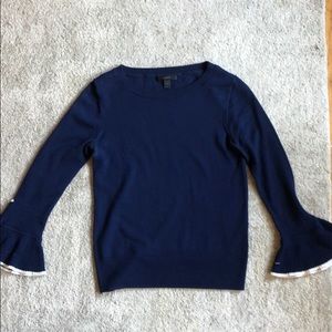Navy J Crew sweater with flared sleeves